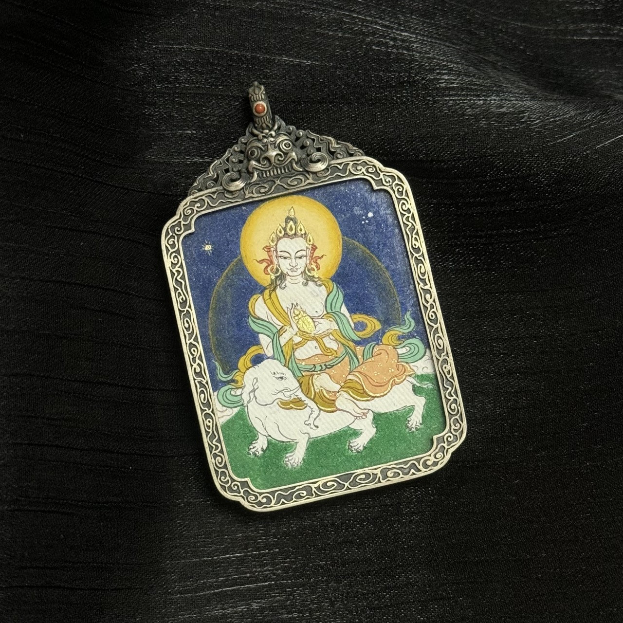 Close-up of Samantabhadra Bodhisattva thangka pendant, representing moral discipline, perseverance, and spiritual fulfillment.