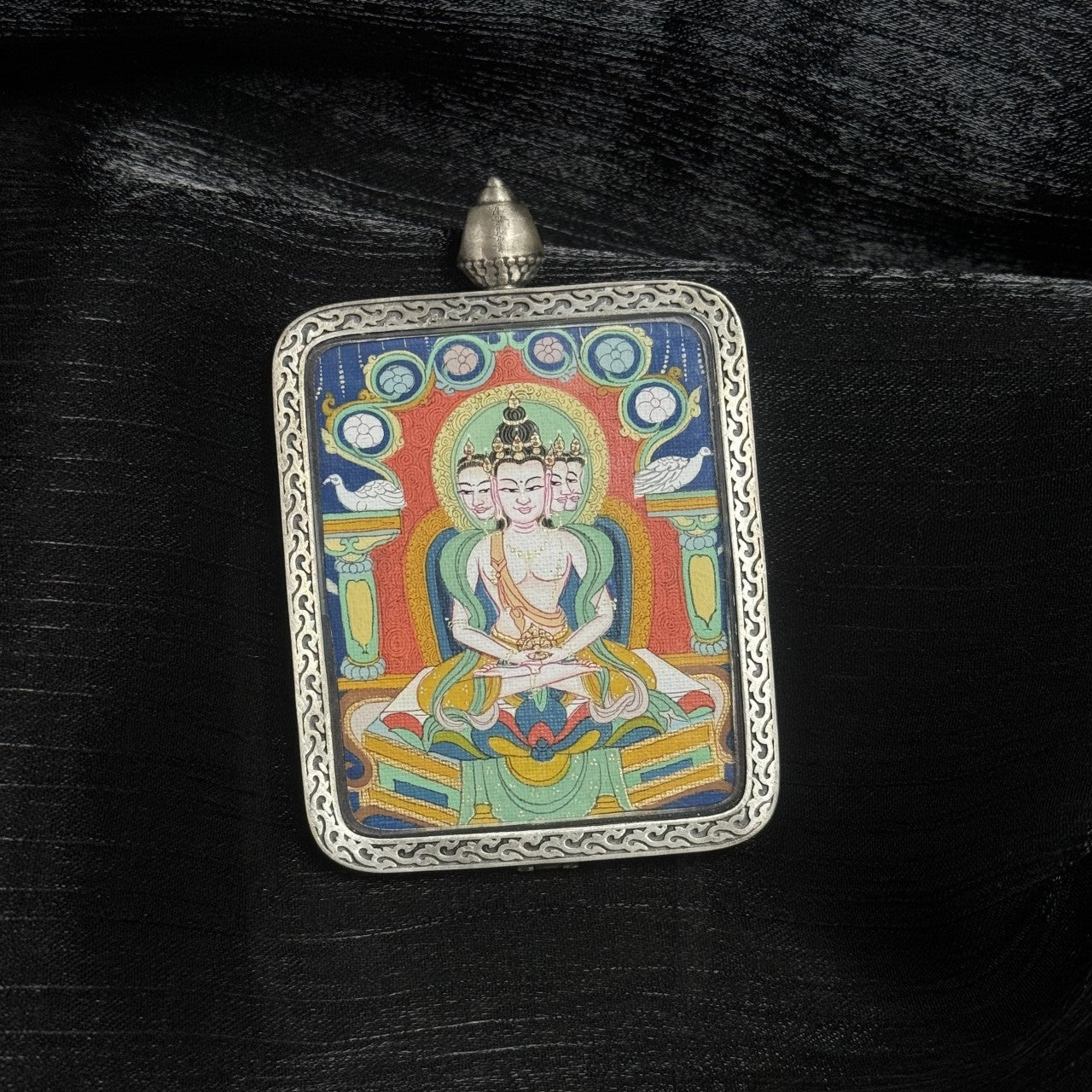 Square Vairocana Buddha mini Thangka pendant in ornate silver frame, crafted in Tibet