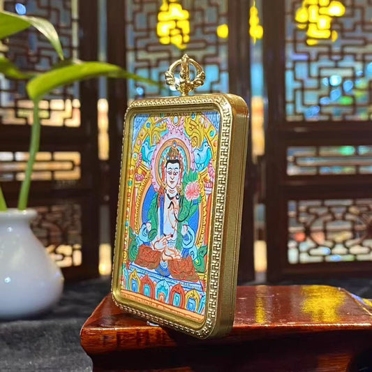 Side view of titanium steel gau pendant housing a hand-painted Akashagarbha Bodhisattva thangka