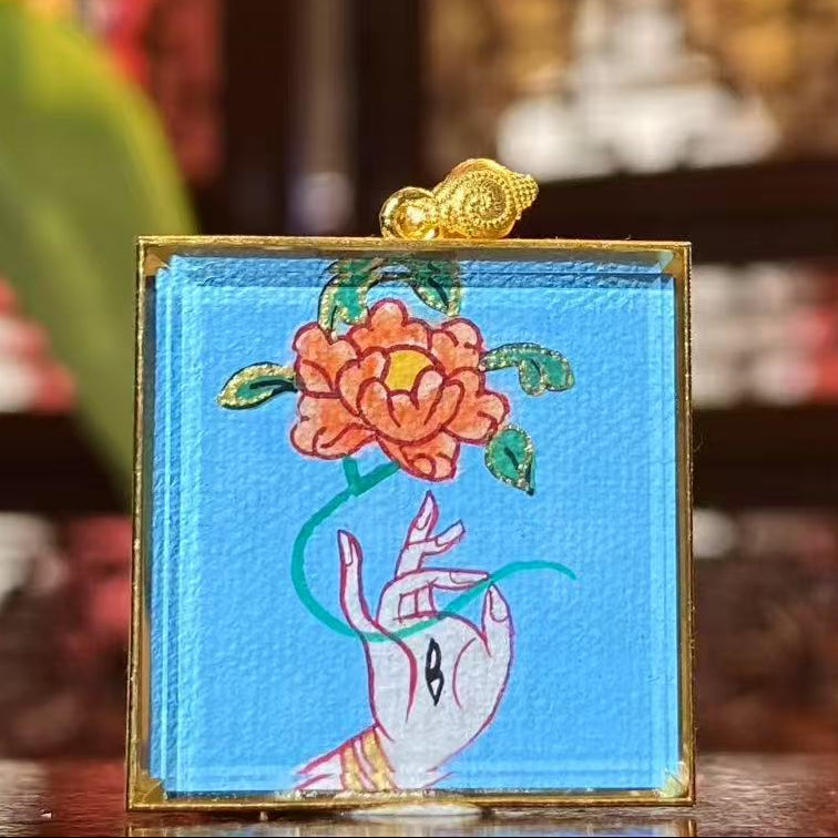 Back view of double-sided Tibetan mini thangka pendant featuring sacred Utpala Flower symbolism associated with White Tara