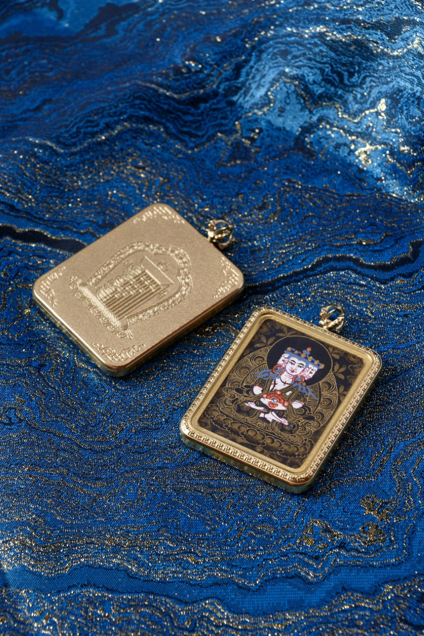 Hand-painted Vairocana (Mahavairocana) black gold thangka pendant with matching titanium steel case on blue brocade background
