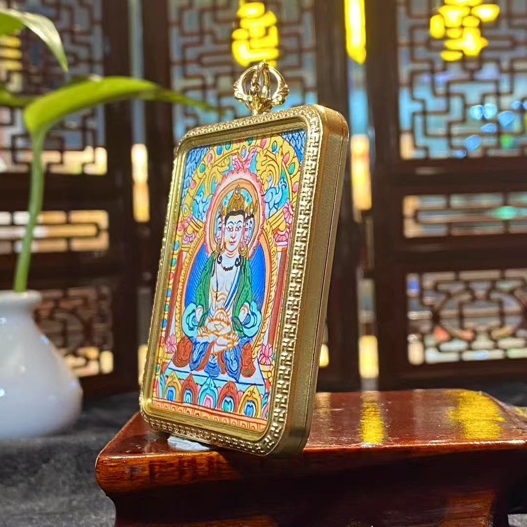 Close-up detail of a hand-painted Vairocana Buddha large mini thangka pendant mounted in a titanium steel Tibetan Gawu box, 56×46mm