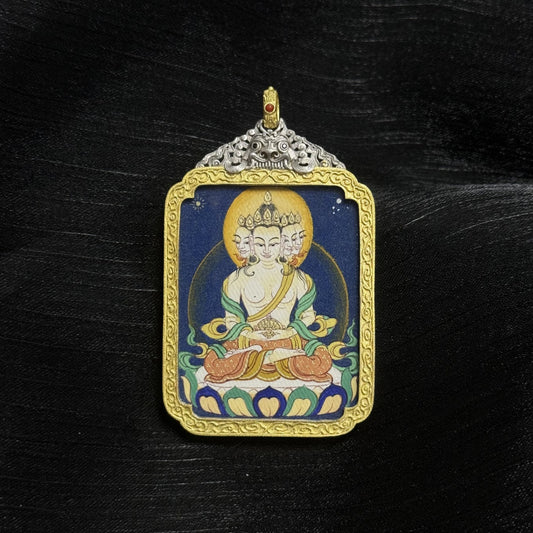 Hand-painted Vairocana Buddha mini thangka pendant from Tibet, featuring five-faced Vairocana iconography, natural mineral pigments, and an electroplated silver case, front view.
