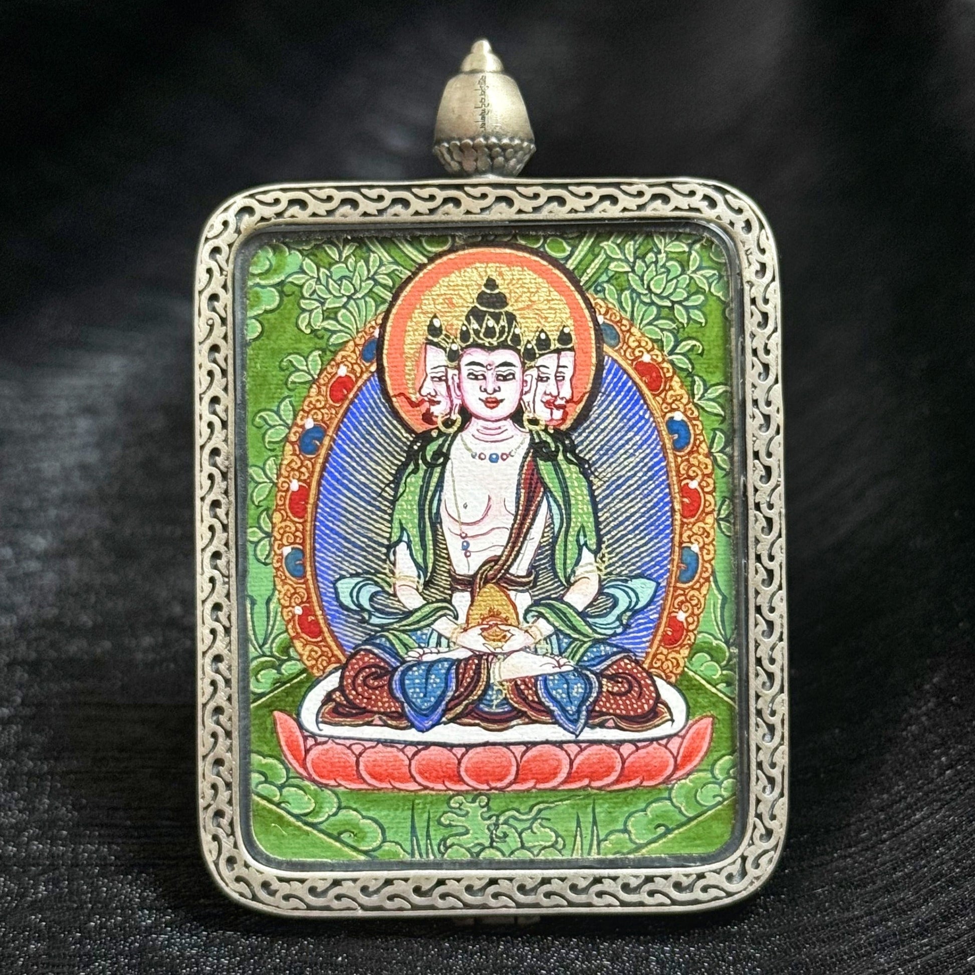 Collector-grade Vairocana Buddha Rebgong Cui Thangka pendant, hand-painted with mineral pigments in the Chinese Intangible Cultural Heritage tradition, set in 925 silver, 3.5 × 4.5 cm
