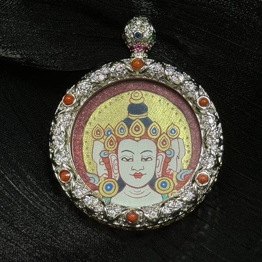 Hand-painted Vairocana Buddha mini thangka pendant from Rebgong, featuring a red cinnabar mineral pigment background and layered gold powder halo, 3.0 cm