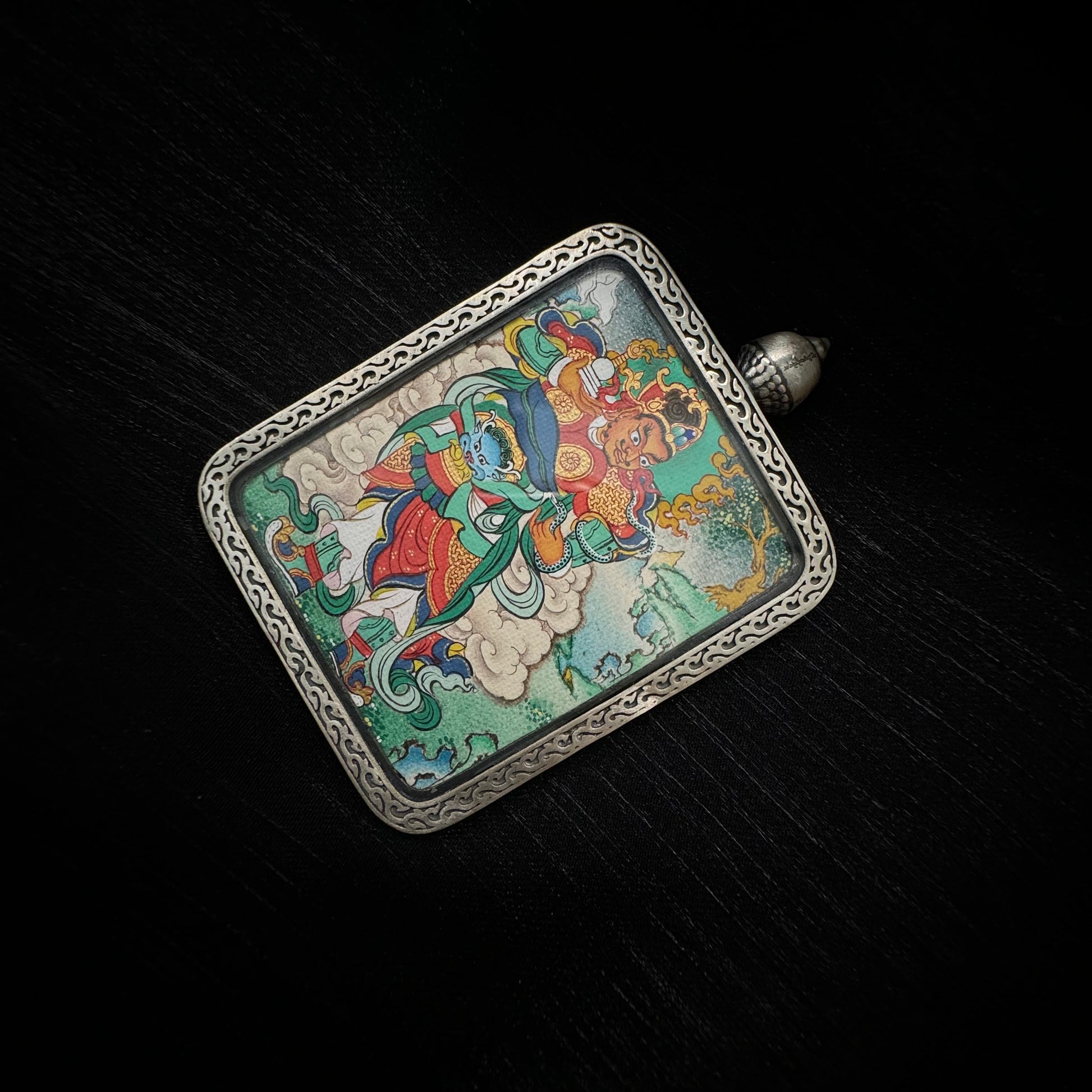 Detailed view of Virupaksha Western Guardian King deity painting in mini thangka pendant with traditional Tibetan iconography