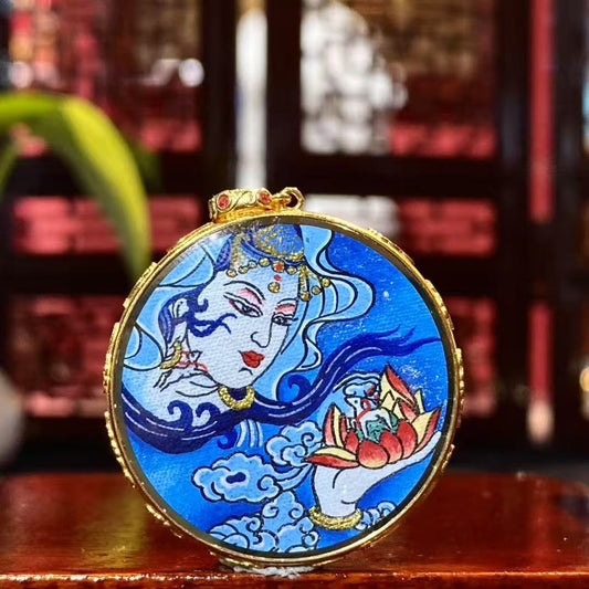Front view of Water Moon Guanyin Gau pendant, dual-sided and hand-painted with 18K gold in the Rebgong Tibetan tradition
