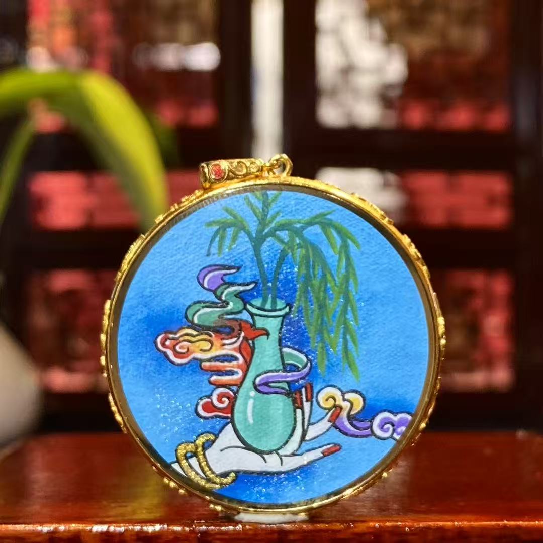 Back view of Water Moon Guanyin Gau pendant featuring hand-painted Pure Vase symbolism in 18K gold
