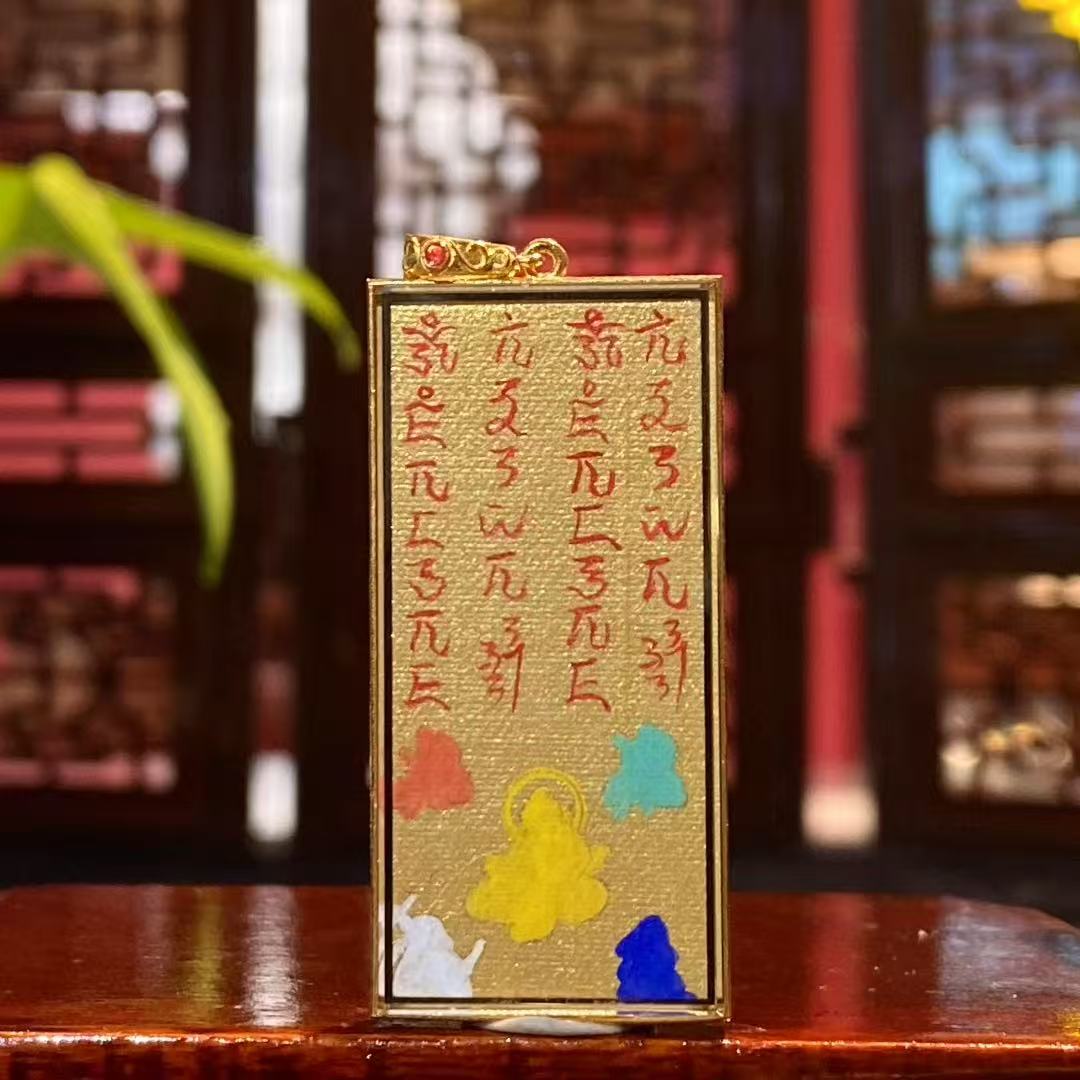 Back view of Gau Thangka pendant featuring a hand-painted Wealth Mantra in traditional Rebgong style, designed for daily wear and spiritual focus