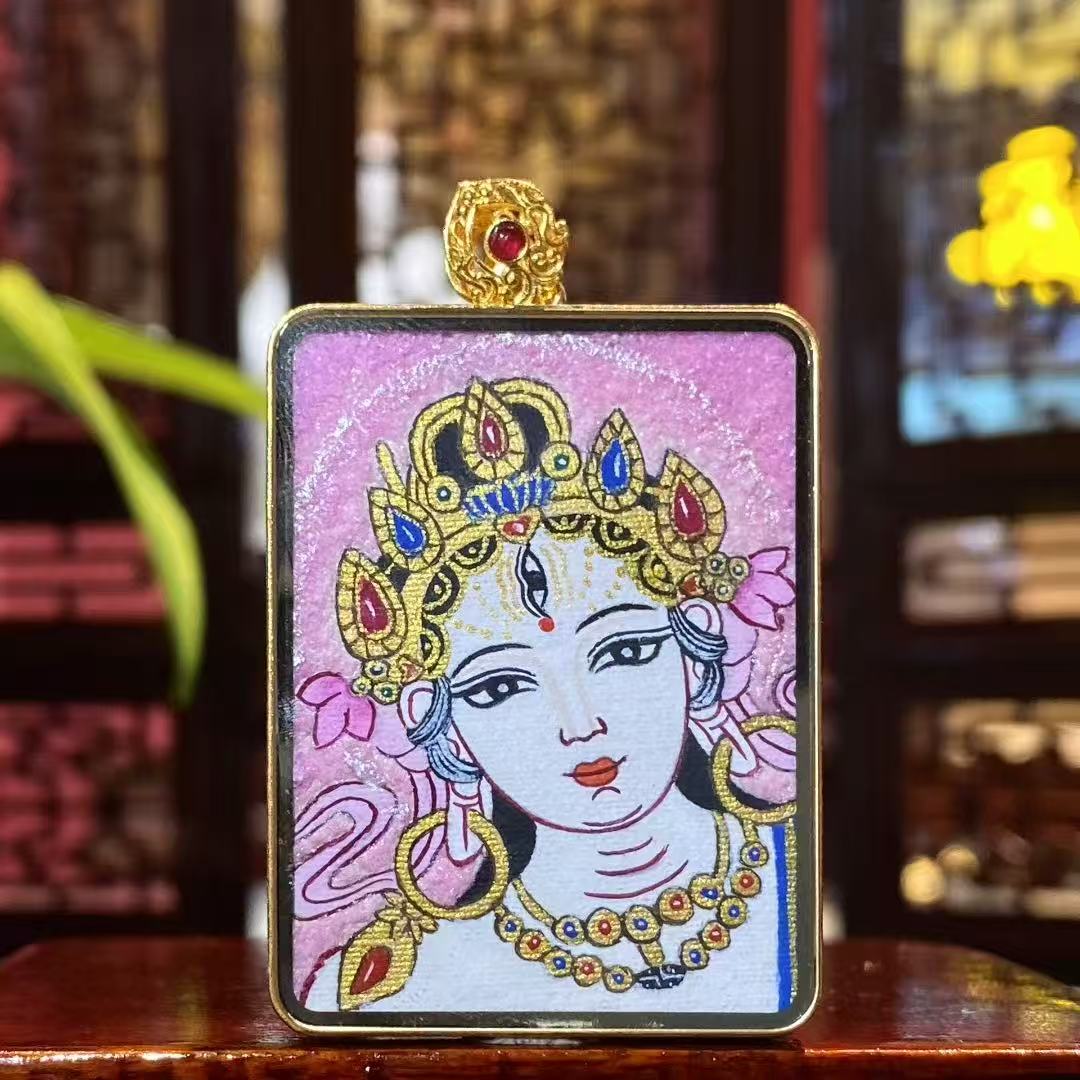 Back view of a double-sided Tibetan Ghau Thangka pendant featuring White Tara, hand-painted in 18K gold using traditional Rebgong art