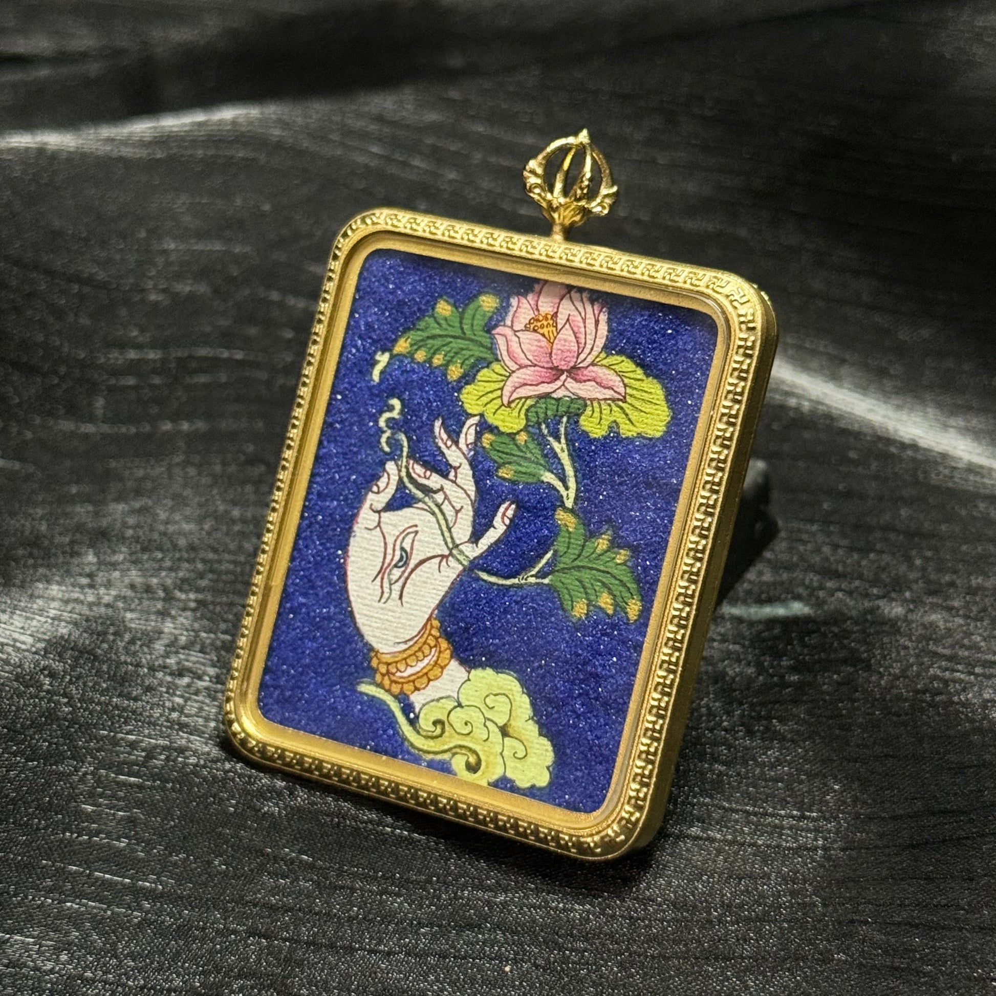 Front view of a White Tara sacred hand mini thangka pendant depicting a lotus flower and Tara hand gesture in traditional Himalayan Buddhist iconography.