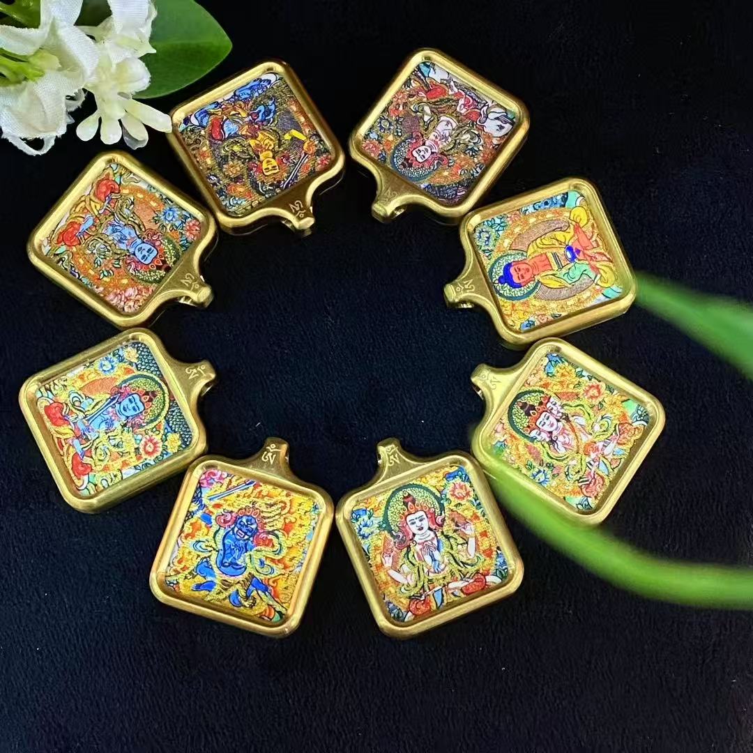 Gold-outlined Tibetan thangka pendants designed for spiritual shops, meditation brands, and cultural gift wholesalers