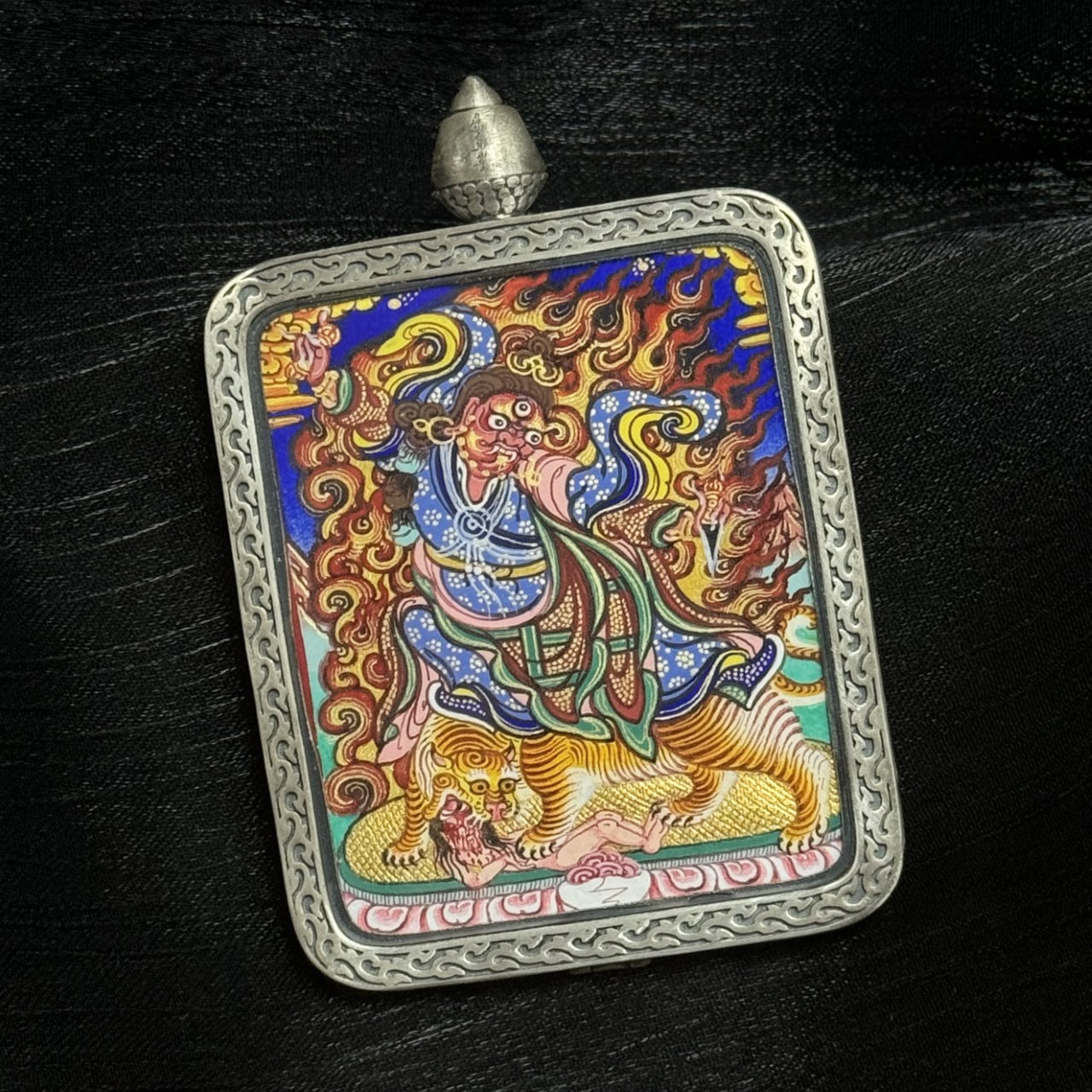 Close-up detail of wrathful Guru Rinpoche thangka, hand-painted in Rebgong style with natural mineral pigments, vivid lines and sacred iconography