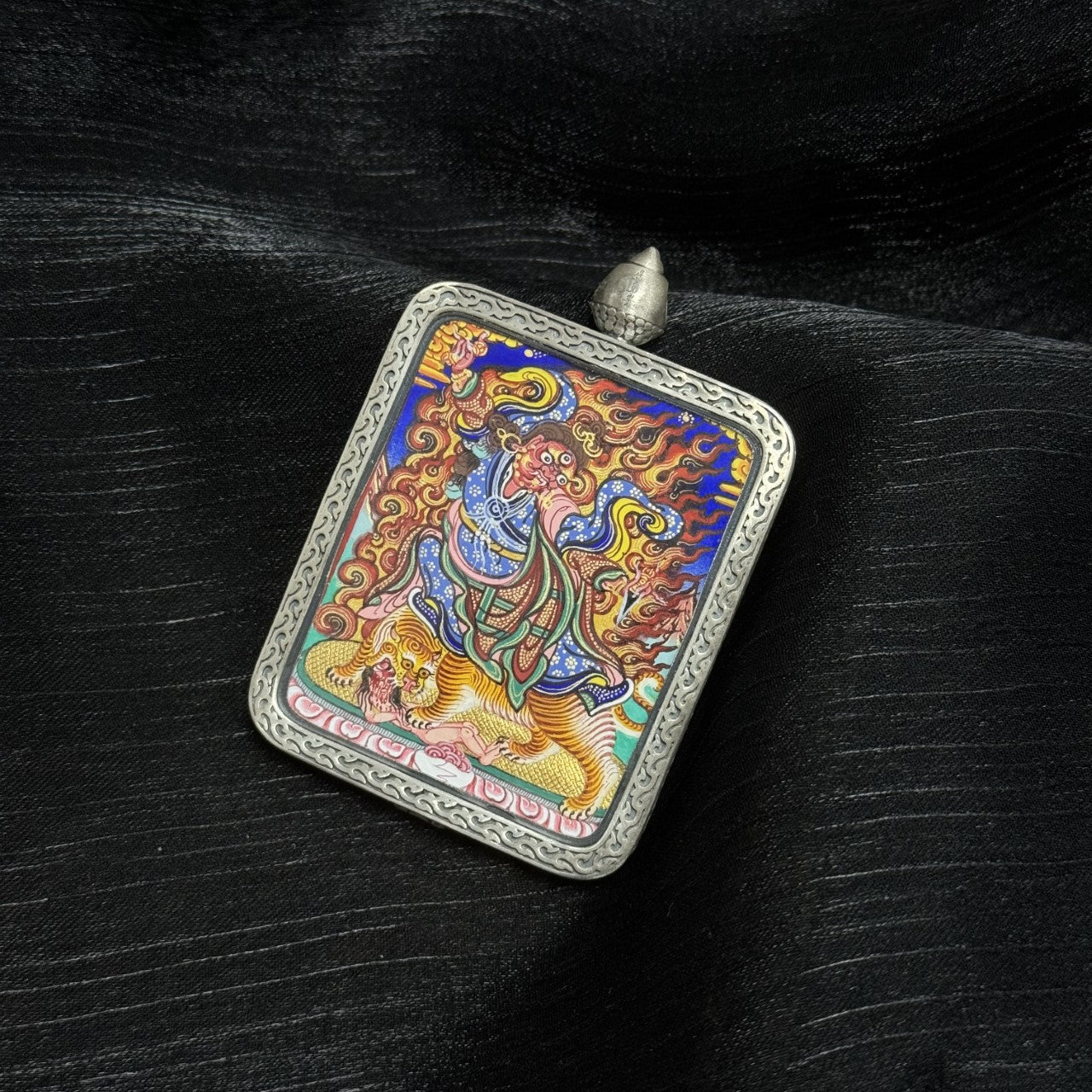 Wrathful Guru Rinpoche thangka pendant from Rebgong, hand-painted with natural mineral pigments, silver protective case, collectible Tibetan Buddhist art
