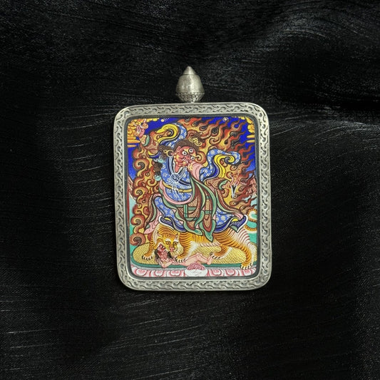 Front view of wrathful Padmasambhava thangka pendant, Rebgong style Tibetan painting, natural mineral pigments, silver frame, master-level craftsmanship