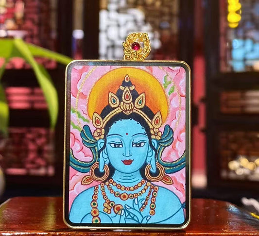 Front view of Yellow Jambhala Gau Thangka pendant in 18K gold, hand-painted in traditional Rebgong style with mineral pigments