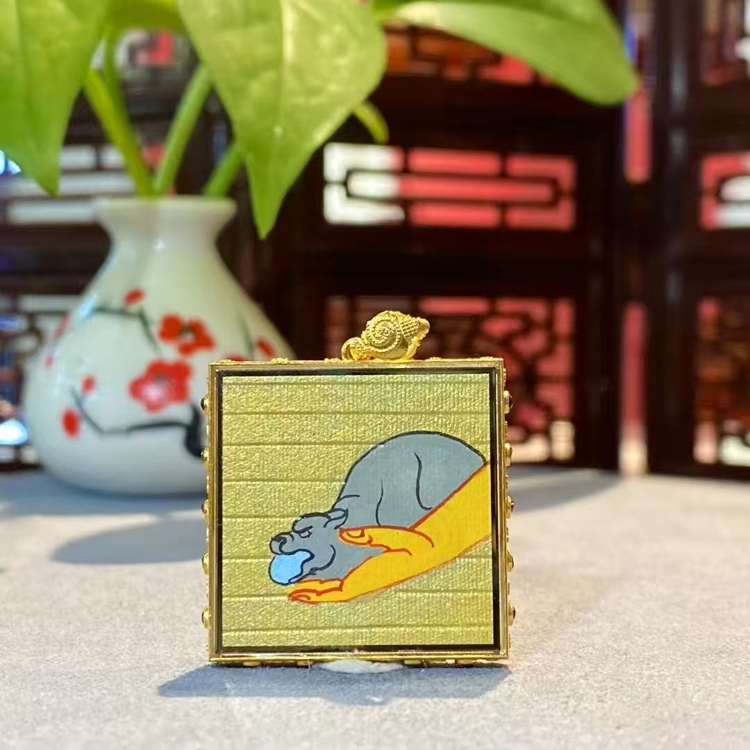 Back view of double-sided hand-painted Yellow Jambhala Gawu pendant showing the jewel-spitting mongoose symbol of continuous wealth