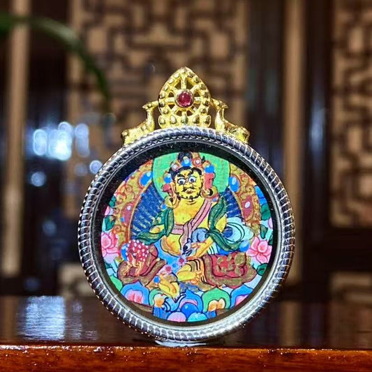 Front view of hand-painted Yellow Jambhala Thangka set in an S925 sterling silver Tibetan Gawu pendant, God of Wealth amulet