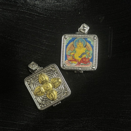 Front and back view of Yellow Jambhala mini thangka pendant, hand-painted deity image on square panel, 925 silver electroplated case with beaded border and gold-tone double vajra back plate