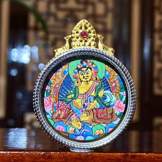 Hand-painted Yellow Jambhala mini Thangka pendant in a 925 sterling silver Gau box, featuring the Tibetan God of Wealth