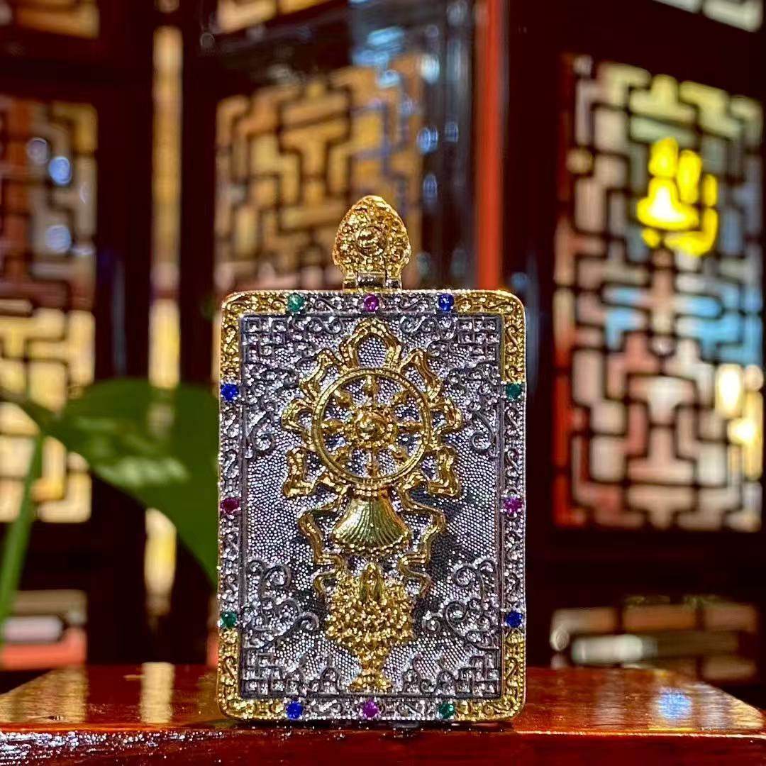 Back view of Tibetan Yellow Jambhala Gawu pendant, traditional Buddhist amulet box design