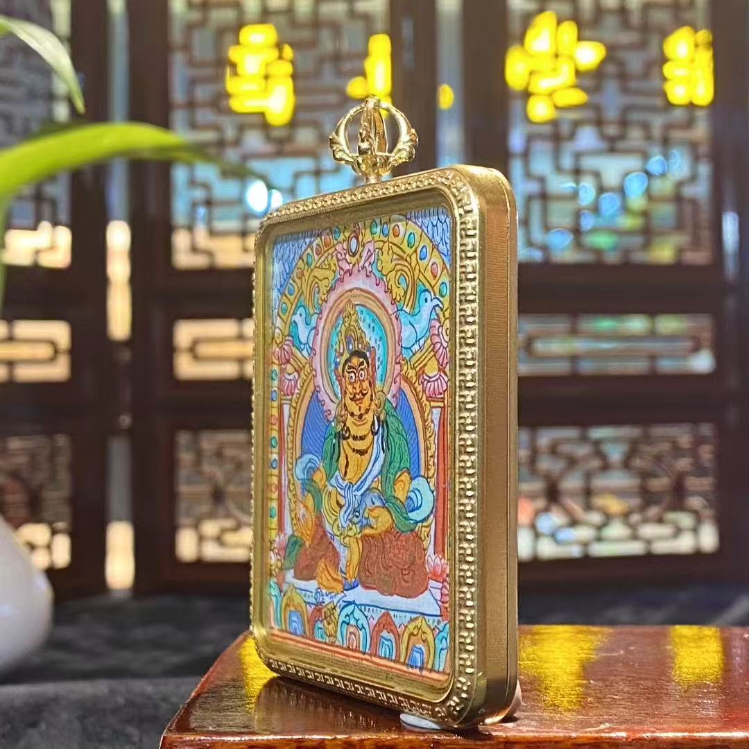 Side view of Tibetan Yellow Jambhala Gawu pendant showing titanium steel construction and solid thickness