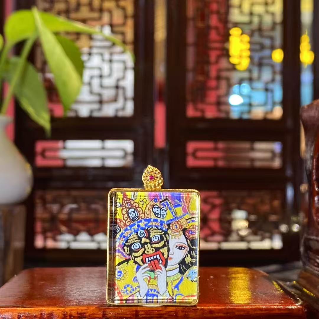 Front view of a double-sided Tibetan Ghau Thangka pendant featuring Zaki Lham, hand-painted in 18K gold using Rebgong Thangka techniques