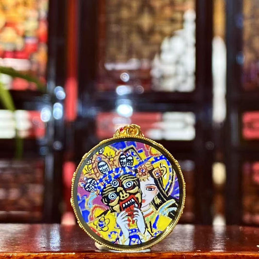 Front view of a double-sided Tibetan Ghau Thangka pendant featuring Zaki Lham, hand-painted in 18K gold using Rebgong Thangka techniques