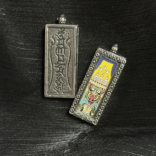 Front and back view of Zaki Lhamo pendant: hand-painted deity image on the front and embossed Tibetan script/mantra on the back metal plate.