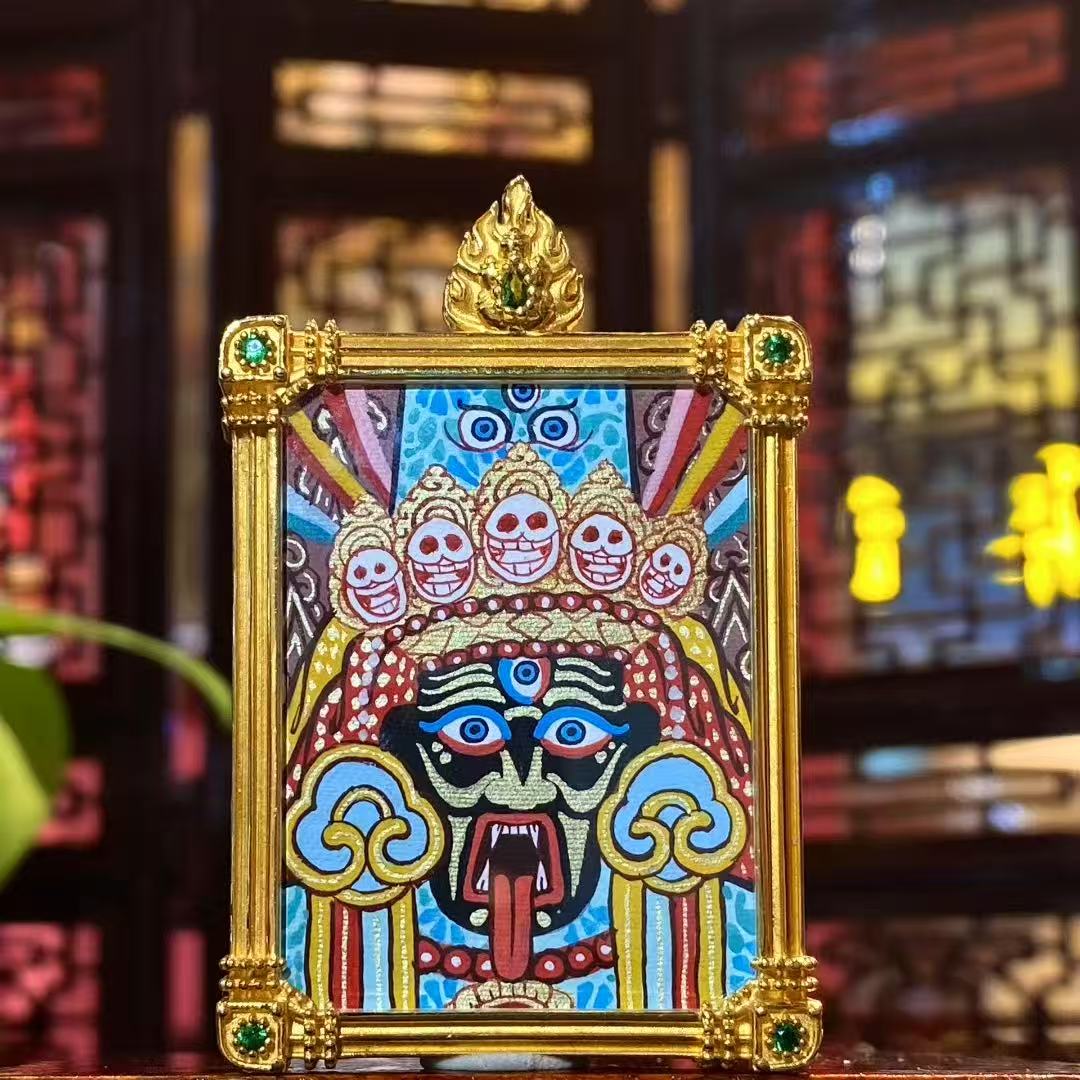 Front view of Zaki Lhamo Tibetan Thangka pendant, double-sided and fully hand-painted in 18K gold, Rebgong style, set in a traditional Gawu box