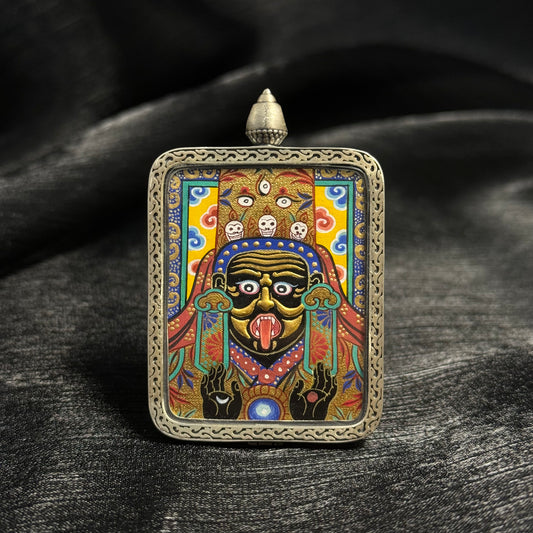 Front view of Zaki Lhamo gold relief mini thangka pendant featuring layered gold powder painting, vivid mineral pigments, and a finely crafted 925 silver pendant frame.