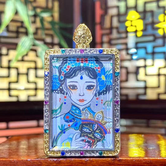 Front view of a hand-painted Zaki Lhamo thangka pendant depicting the Tibetan guardian goddess, set in a traditional copper gau box