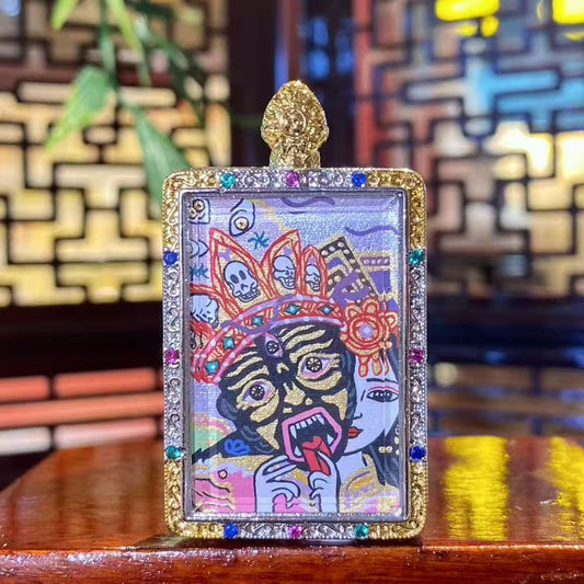 Front view of a hand-painted Zaki Lhamo thangka pendant depicting the Tibetan guardian goddess, set in a traditional copper gau box