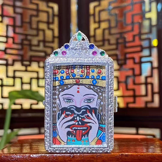 Hand-painted Zaki Lhamo thangka pendant showing the fierce guardian goddess, set in a traditional silver-tone copper gau box with gemstone details