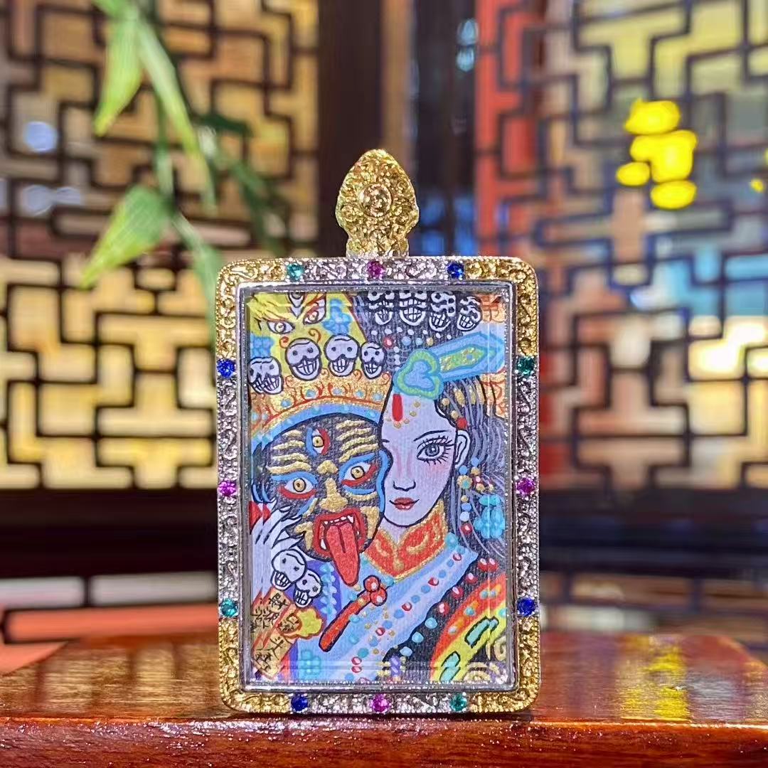 Front view of a hand-painted Zaki Lhamo thangka pendant depicting the Tibetan protector goddess, set in a traditional copper gau box