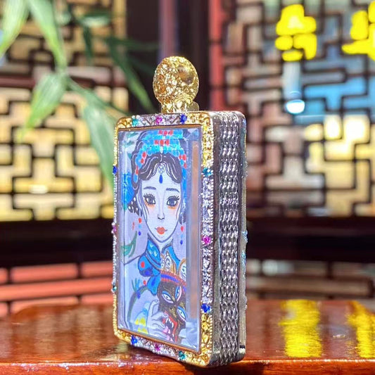 Side view of the Zaki Lhamo thangka pendant showing the thickness and metal craftsmanship of the copper gau box