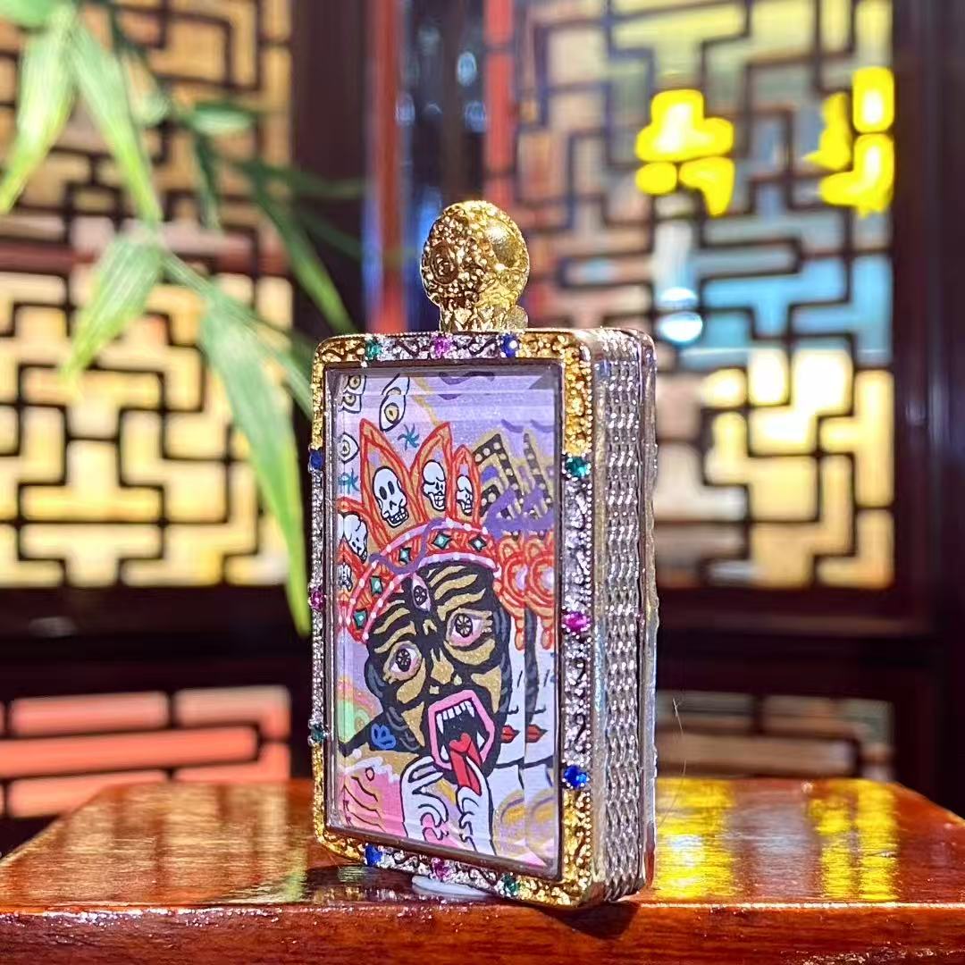 Side view of the Zaki Lhamo thangka pendant showing the thickness and metal craftsmanship of the copper gau box