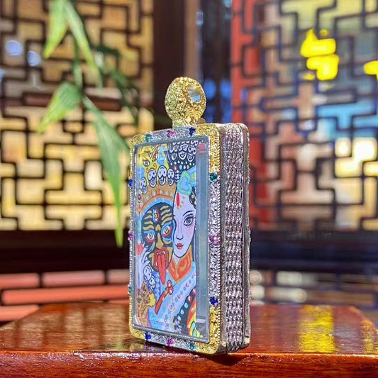 Side view of the Zaki Lhamo thangka pendant showing the thickness and metal craftsmanship of the traditional copper gau box