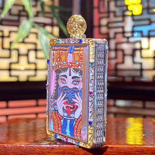 Side view of the Zaki Lhamo thangka pendant showing the thickness and metal craftsmanship of the copper gau box