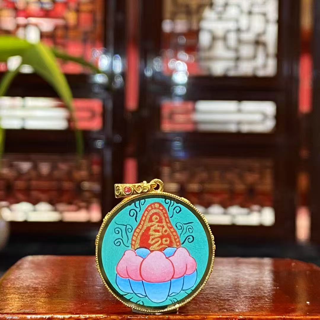 Back view of a double-sided Tibetan Ghau Thangka pendant featuring Zaki mantra seed syllable, hand-painted in 18K gold