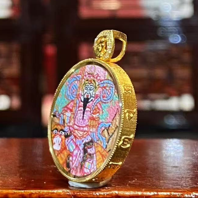 Side view of Zhao Gongming Taoist Thangka pendant showing 18K gold Gawu box craftsmanship and sapphire crystal protective lens