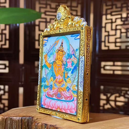 Side view of a Manjushri Bodhisattva mini thangka pendant showing the detailed gold-plated copper Gau box frame