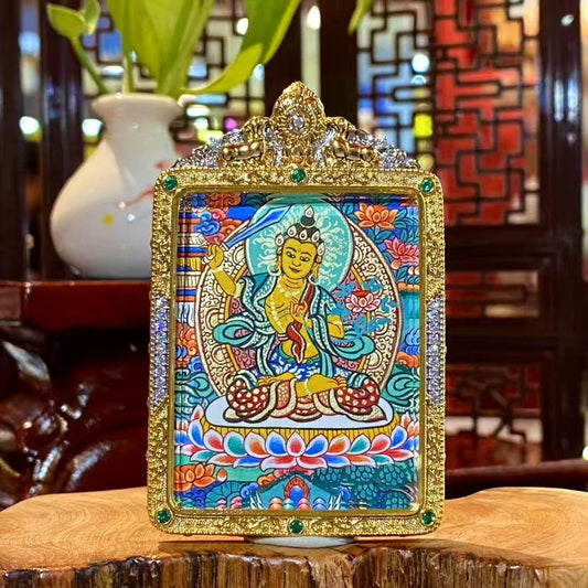 Hand-painted Manjushri Bodhisattva mini thangka pendant showing a dynamic wisdom posture, set in a gold-plated copper Gau box