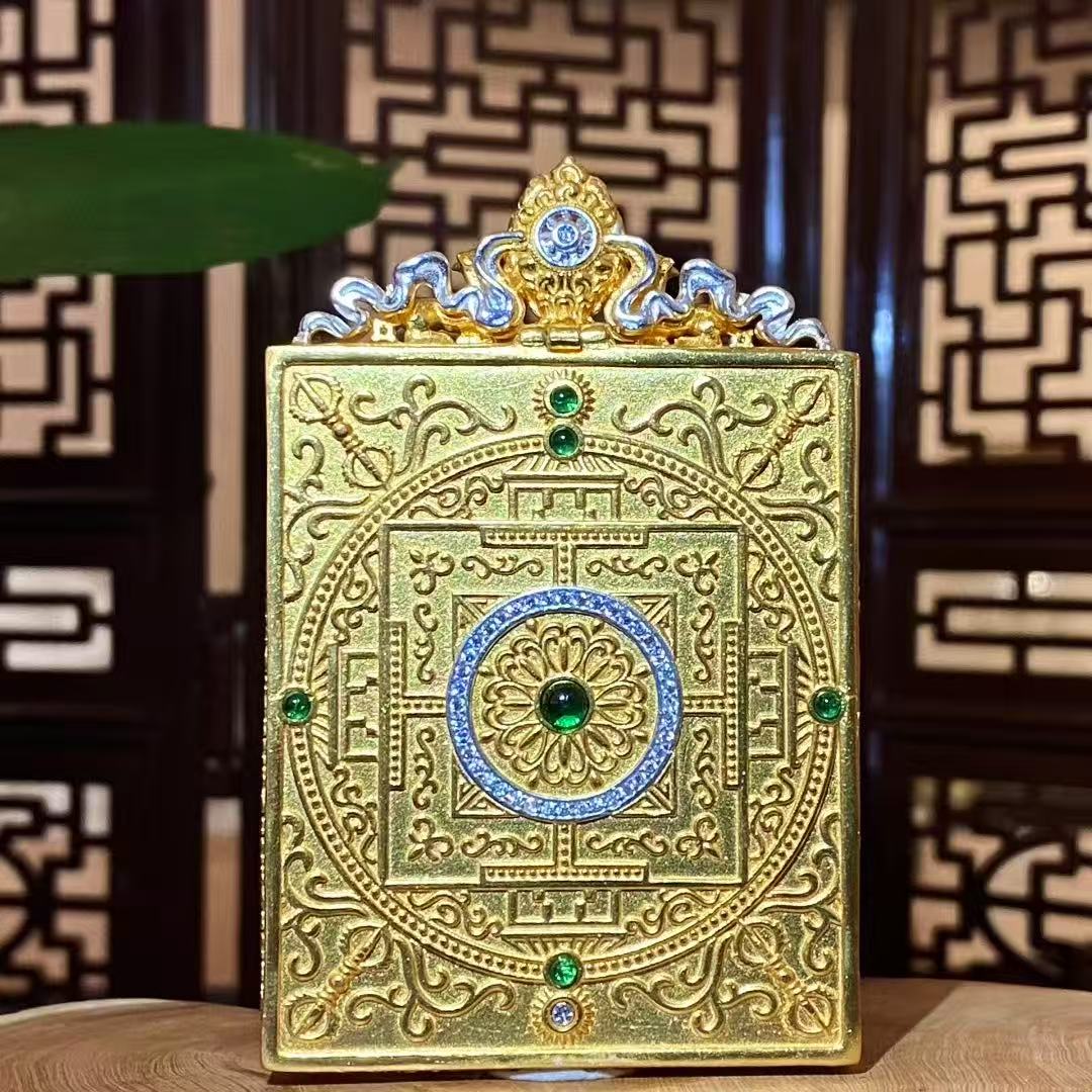 Back view of a Manjushri Bodhisattva mini thangka pendant featuring a square mandala engraved on a gold-plated copper Gau box