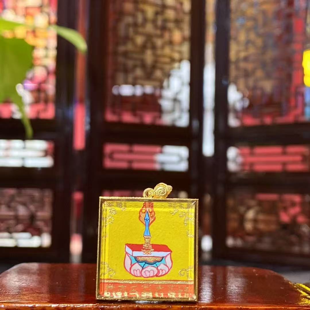 Back view of a double-sided Manjushri Bodhisattva mini thangka pendant featuring the Wisdom Sword symbolizing the cutting of ignorance