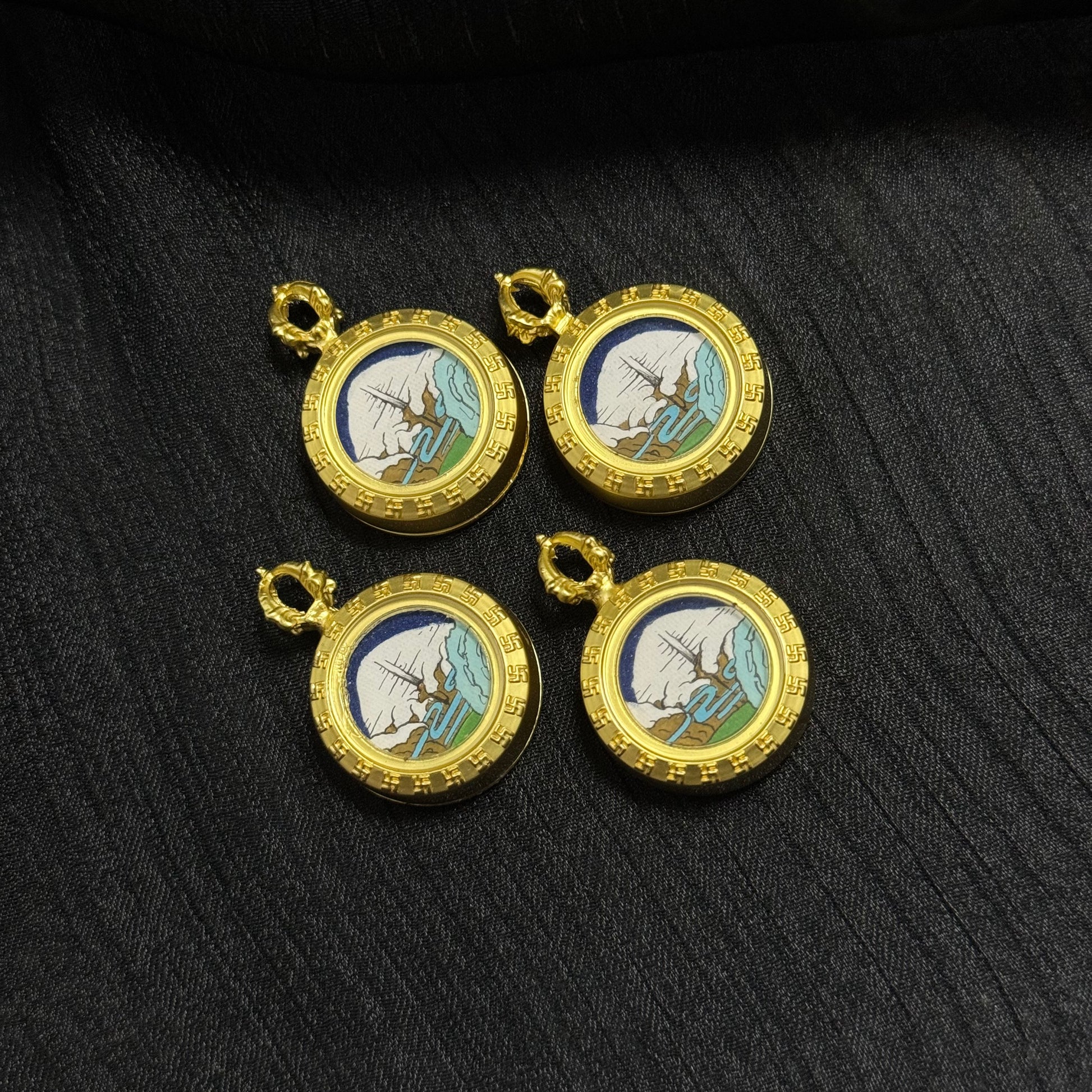 Group display of Mount Kailash Golden Summit mini thangka pendants, Rebgong hand-painted sacred mountain landscape pendants with gold Tibetan style frames