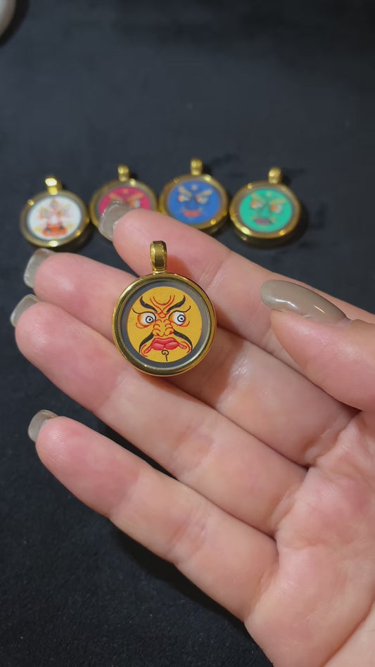 Short video showcasing a hand-painted Yellow Jambhala Thangka Gawu pendant in titanium steel, highlighting craftsmanship, consecrated contents, and compact design for daily wear