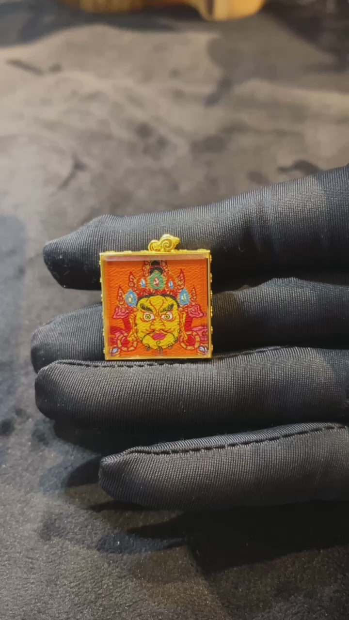Double-sided hand-painted Yellow Jambhala and treasure-spitting mongoose mini Thangka pendant in an 18K gold Gau box with sapphire crystal glass