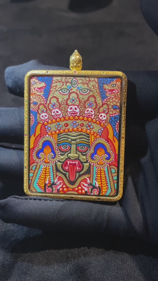Product video showcasing a double-sided Green Tara and Zaki Lhamo Thangka pendant, hand-painted with 18K gold in Rebgong tradition, set in a sapphire crystal Gau box.
