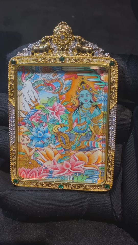 Vidio of a hand-painted Green Tara thangka pendant in a gilded copper Ghau box, size 55 × 45 mm